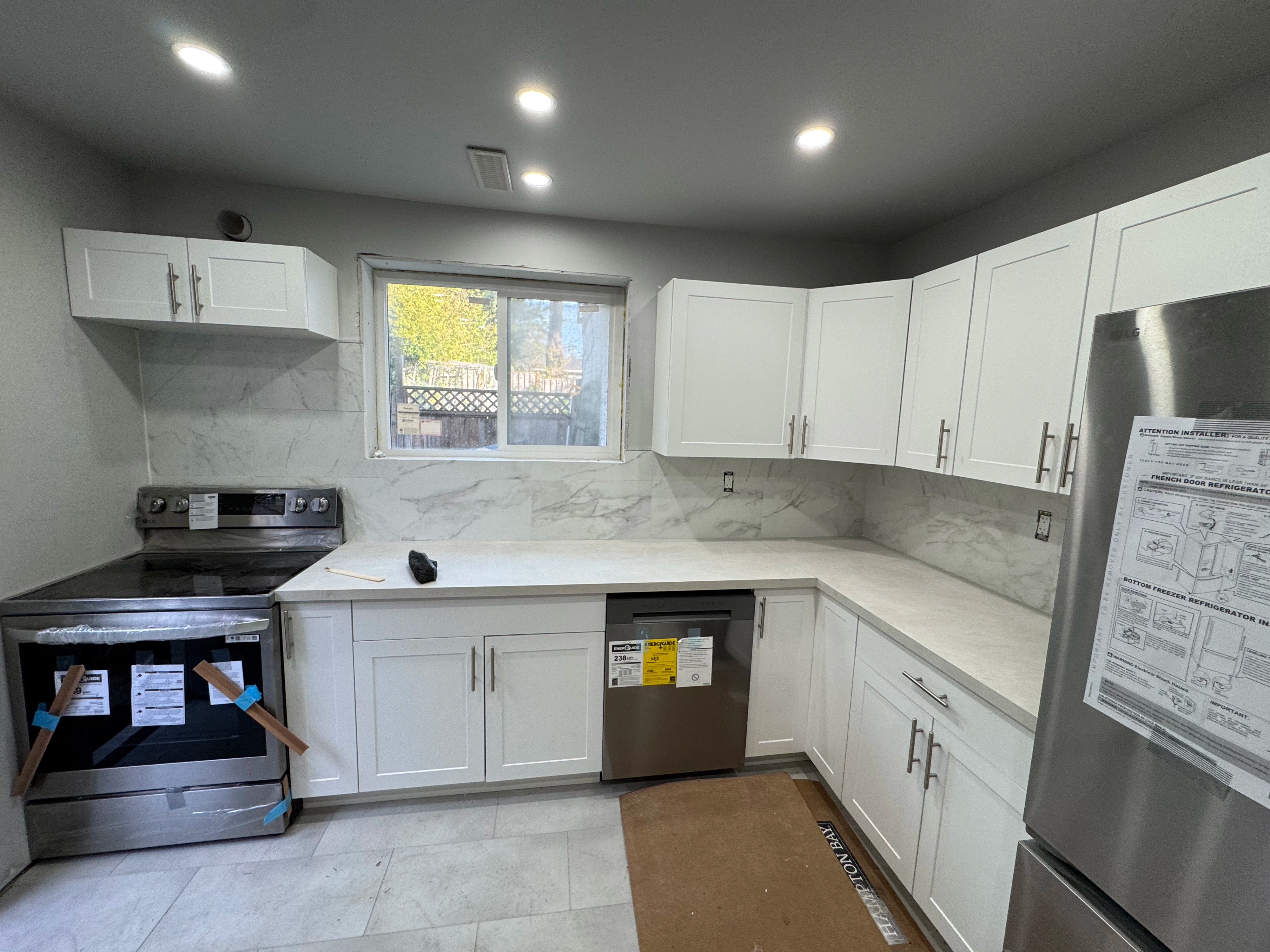 condo kitchen and marble baths by CVR Construction