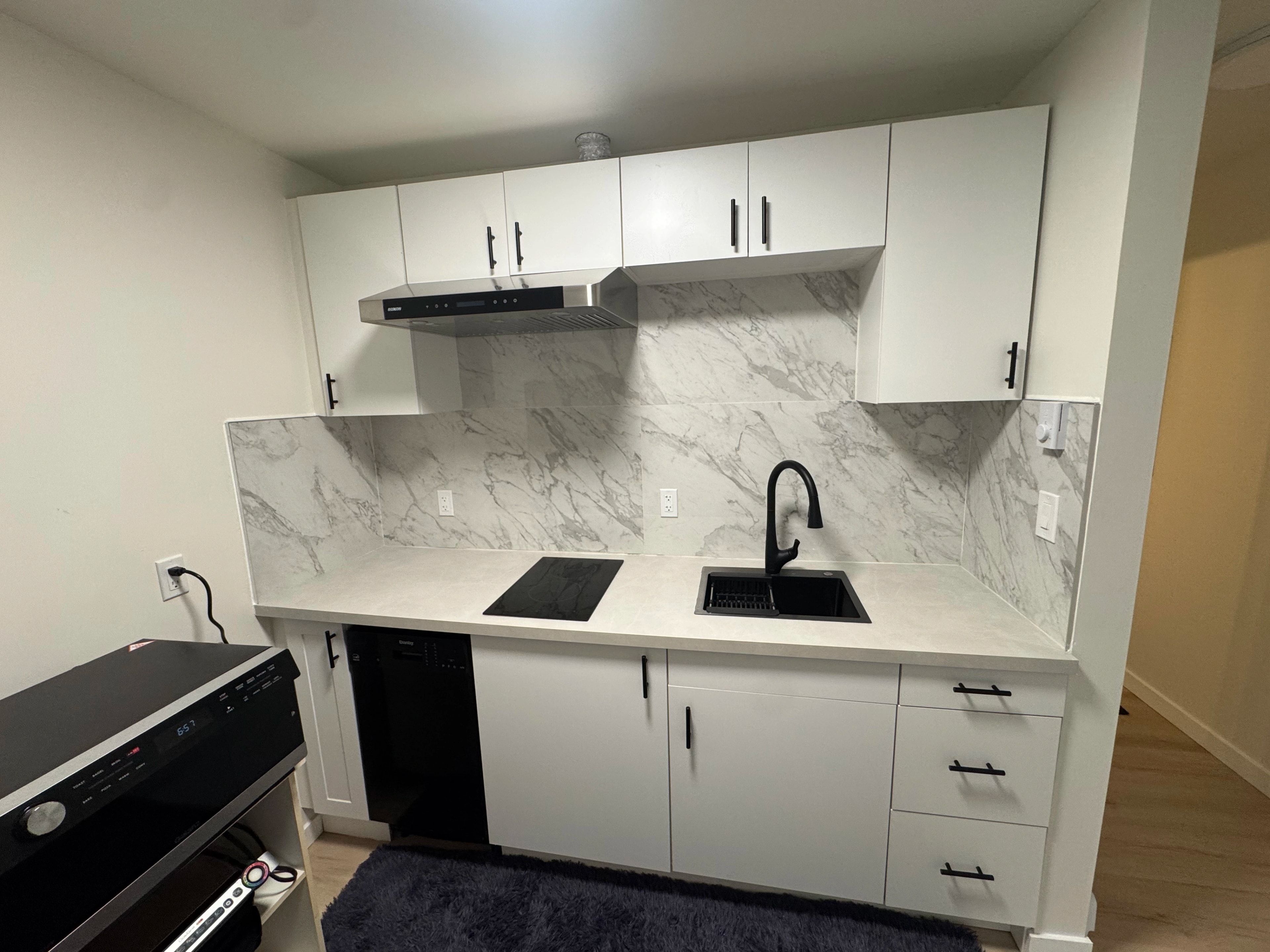 condo kitchen and marble baths by CVR Construction
